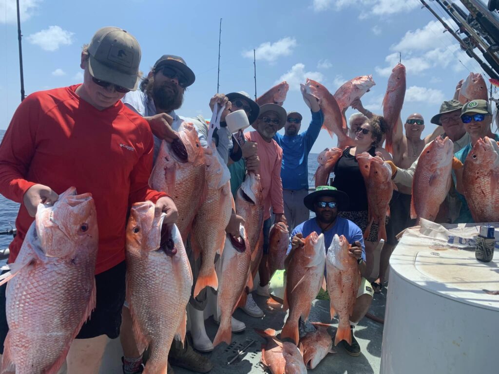 Large group holding redsnapper from Bluefin F/V